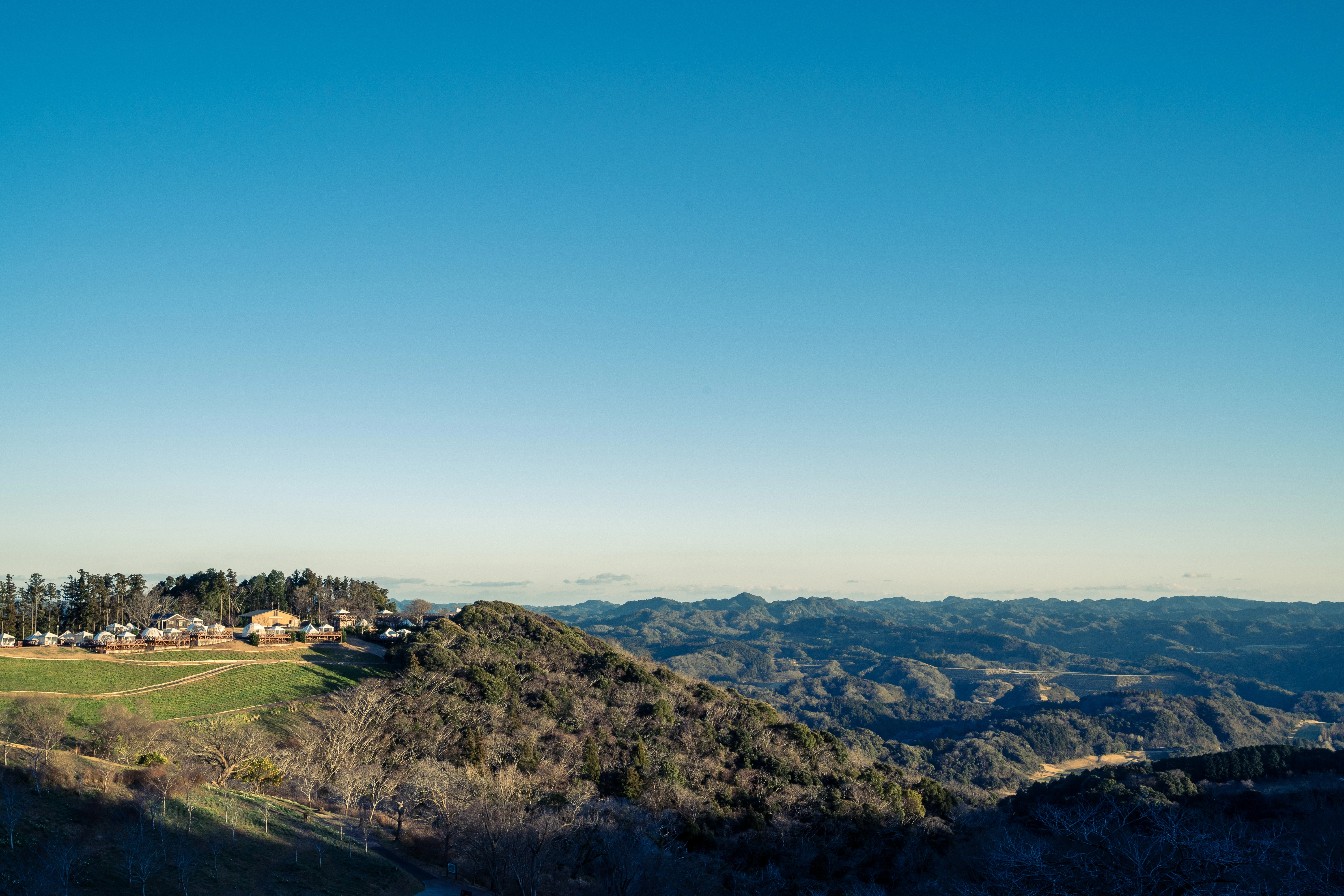 Hillside Village Under a Clear Blue Sky